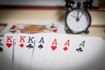 Poker of cards, clocks