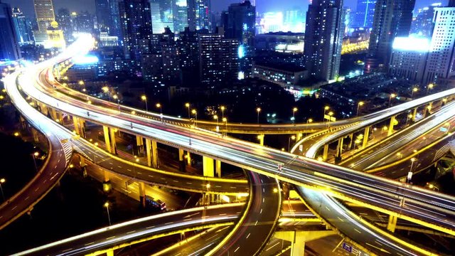 4k Timelapse of freeway busy city rush hour heavy traffic jam highway Shanghai at night,Yan'an East Road Overpass interchange,the light trails of traffic with super long exposures,urban building.