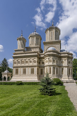 Fototapeta na wymiar Beautiful vertical view of the Curtea de Arges Monastery and Cathedral on a sunny day, Romania