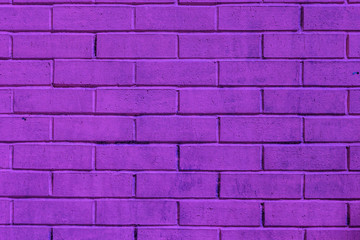 Fototapeta na wymiar Purple painted brick wall