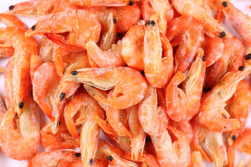 Frozen fresh shrimp on white background (isolated). Snack to beer. Close up