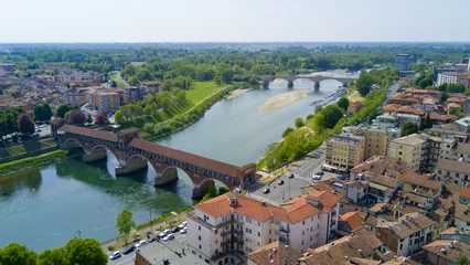 Raamstickers Aerial video shooting with drone on Pavia, famous Lombardia city near the Ticino river in northern Italy © immaginario75