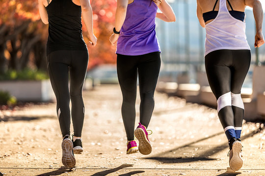 Three Young Women Running