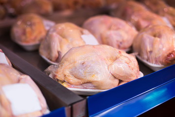 Raw chicken on the supermarket shelves