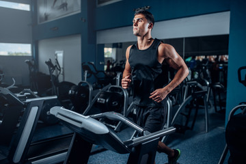 Fototapeta na wymiar Male athlete workout on running exercise machine