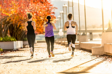 three young women running