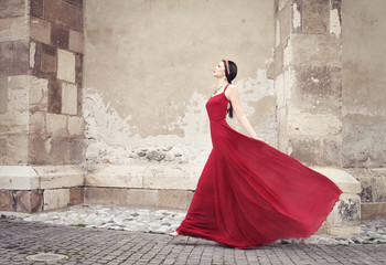 Woman in red dress walking
