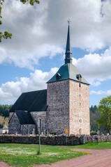 Fototapeta na wymiar The Babtist Church of St. John and cemetery. Sund. Aland Islands, Finland