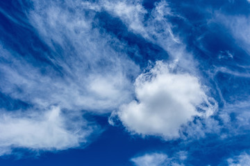 Naklejka na ściany i meble White fluffy clouds in the blue sky background