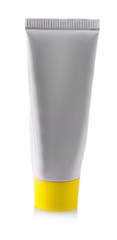 Gray tube with cosmetic cream with yellow cap