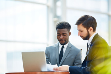 Young business partner signing new contract