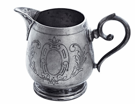 silver Jug of cream on white background