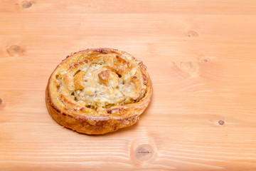 Sweet french pastry with fruits and cream on a natural oak wood table - circular format