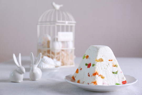 Traditional curd Easter cake with candied fruits on light table