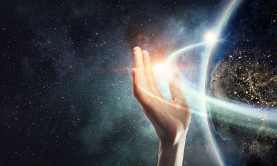 Earth planet in palm . Mixed media