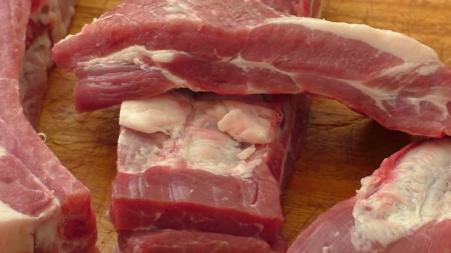 Raw pork ribs on a cutting board
