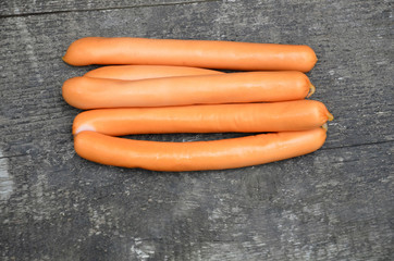 
Thin long suckers lie on a wooden surface.