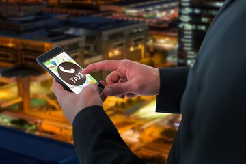 Composite image of businessman using smart phone