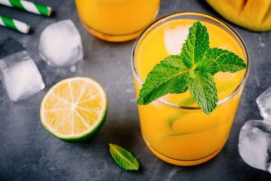 Fresh summer mango cocktail with lime and mint