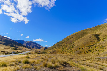 Lindis Pass is the highest point on the South Island's state highway network of New Zealand offering mountain and tussock grassland scenery
