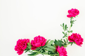 Peony flowers and leaves on white background. Flat lay, top view. Pattern made of flowers