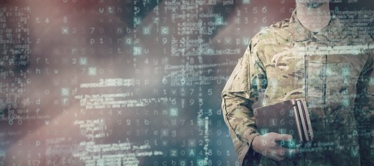 Composite image of mid section of soldier holding books - Powered by Adobe