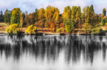 reflection. On the bank of the autumn river
