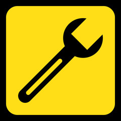 yellow, black information sign - spanner icon