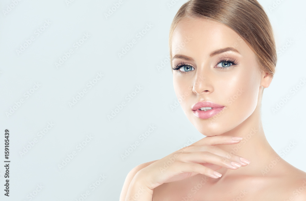 Wall mural beautiful young woman with clean fresh skin . facial treatment . cosmetology , beauty and spa .