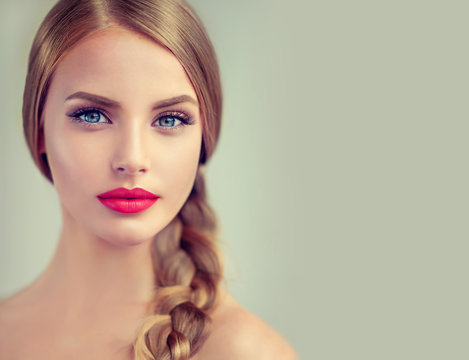  Beautiful young woman with braid hair  and red lips . Fashion ,beauty and cosmetics 