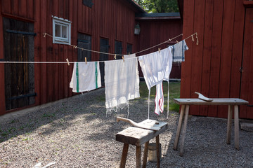 The laundry is hanging out to dry, in fine weather, on a lina outside the farm. The sun shines on the washboard and bleaching the white laundry nicely. © fotograf connyM