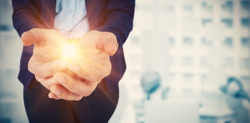Composite image of womans hands cupped 