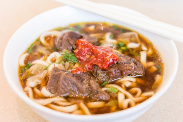 Spicy beef noodle Laksa soup which is a popular traditional spicy noodle soup from the culture in Malaysia.