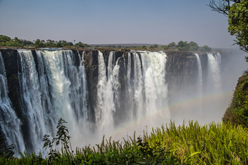Fototapeta na wymiar Victoria falls in a sunny day in Zimbabwe