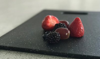 Fruit on chopping board with blurred background