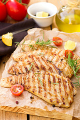 Grilled pork escalopes with rosemary and cherry tomatoes