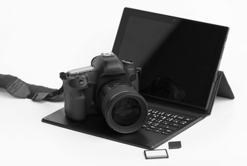 Close-up DSLR Camera lens on laptop.