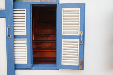 Open blue wooden vintage window