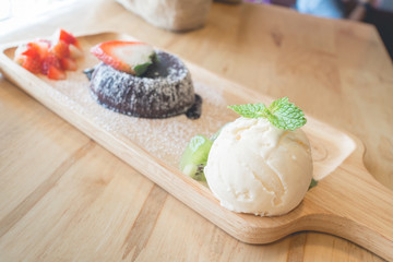 chocolate lava cake with vanilla ice cream and strawberry