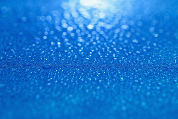 Rain Water droplets on  blue waterproof fabric