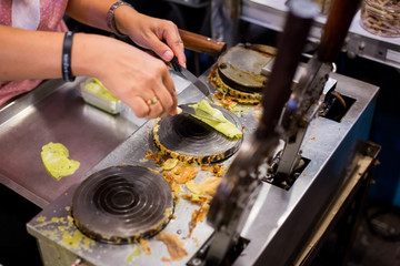 Soft coconut crepe (Thong Mung Fresh) a type of rolled wafer, a traditional dessert in Thailand.