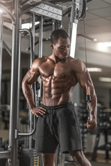 Fototapeta na wymiar Handsome muscular man in gym.