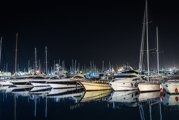 Moored yachts at night