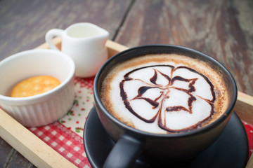 hot coffee with foam milk art in afternoon break