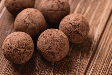 Chocolate truffles on wooden background