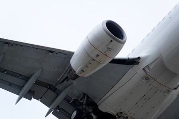 Naklejka na ściany i meble The underside of a modern airplane and its landing gear