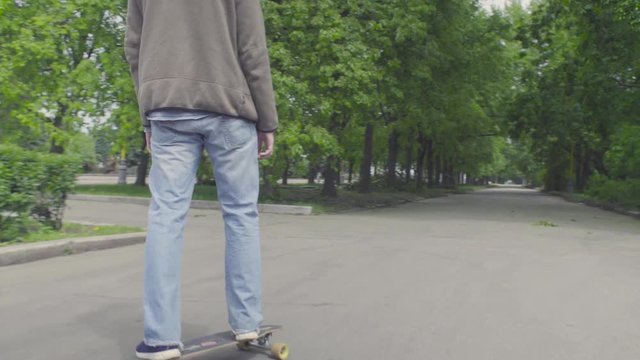 Young man riding on longboard