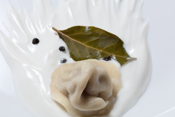 Russian pelmeni, sour cream, bay leaf, pepper.