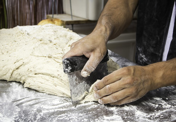 Man kneading bread