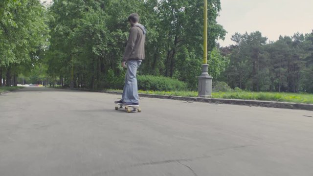 Young man riding on longboard